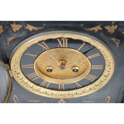 150 - Victorian black slate mantle clock of architectural form, with brass dial, the case with inlaid foli... 