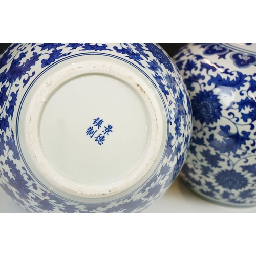 21 - Near pair of Chinese blue & white bottle vases, with scrolling floral and foliate decoration, each w... 