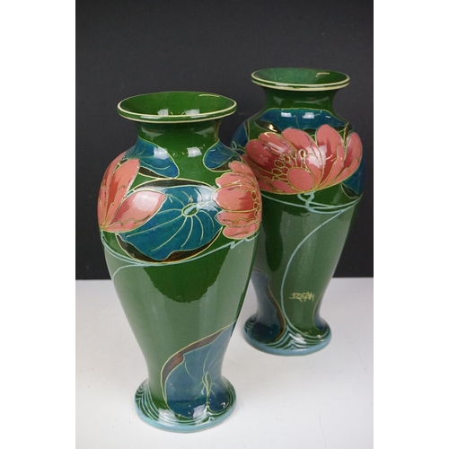 21A - Pair of Phoenix Ware vases of inverted baluster, circa 1920's, with stylised floral decoration on gr... 