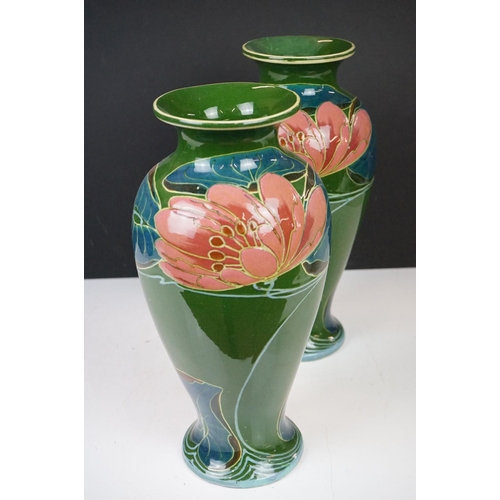 21A - Pair of Phoenix Ware vases of inverted baluster, circa 1920's, with stylised floral decoration on gr... 