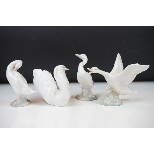 26 - Four Lladro porcelain figures to include 6175 White Swan, 1265 Duck Jumping and two standing geese