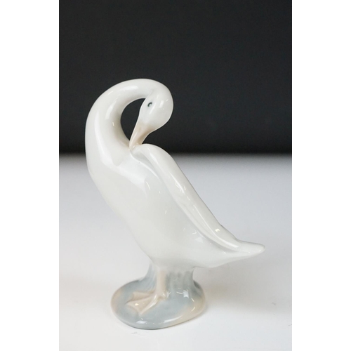 26 - Four Lladro porcelain figures to include 6175 White Swan, 1265 Duck Jumping and two standing geese