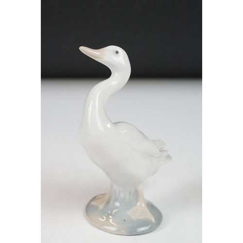 26 - Four Lladro porcelain figures to include 6175 White Swan, 1265 Duck Jumping and two standing geese