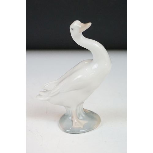 26 - Four Lladro porcelain figures to include 6175 White Swan, 1265 Duck Jumping and two standing geese