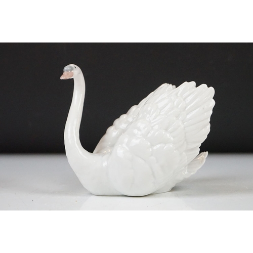 26 - Four Lladro porcelain figures to include 6175 White Swan, 1265 Duck Jumping and two standing geese