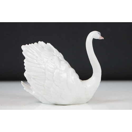 26 - Four Lladro porcelain figures to include 6175 White Swan, 1265 Duck Jumping and two standing geese