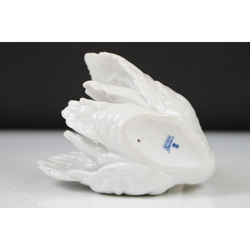 26 - Four Lladro porcelain figures to include 6175 White Swan, 1265 Duck Jumping and two standing geese