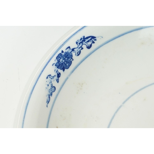 37 - Chinese blue and white circular plate decorated with floral motifs and three blue concentric circles... 