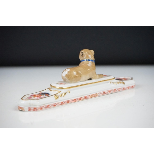 38 - Meissen porcelain paperweight modelled as a recumbent Pug dog (a/f, approx 19cm wide), together with... 