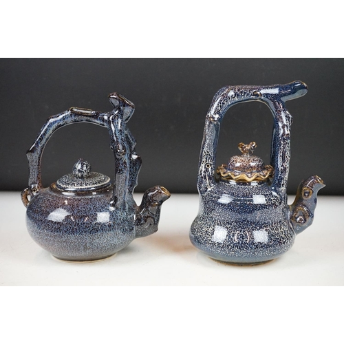 40 - Two Chinese ceramic tea kettles & covers with mottled blue glazing, handles modelled as tree branche... 