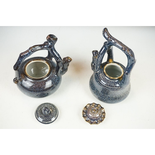 40 - Two Chinese ceramic tea kettles & covers with mottled blue glazing, handles modelled as tree branche... 