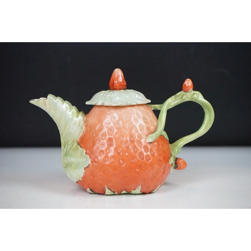 43 - Novelty four-piece tea set in the form of Strawberries, to include a teapot & cover, sugar bowl, mil... 