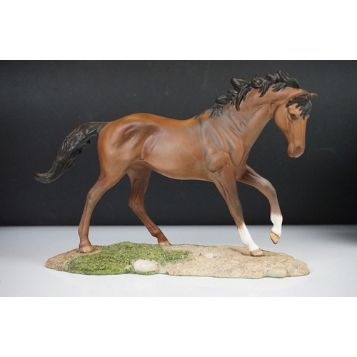 48 - Royal Doulton horse (19.5cm high) and two boxed Lladro collector bells.