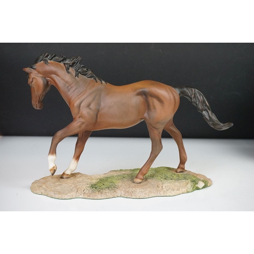 48 - Royal Doulton horse (19.5cm high) and two boxed Lladro collector bells.