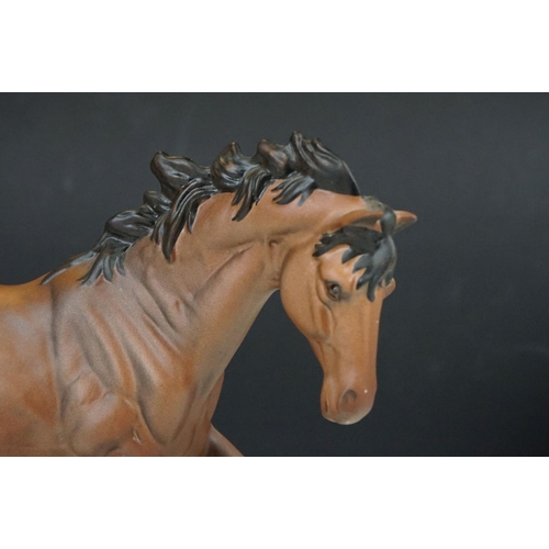 48 - Royal Doulton horse (19.5cm high) and two boxed Lladro collector bells.