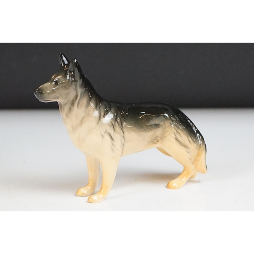 52 - Eight Beswick porcelain dog figures to include Laughing Yorkshire Terrier (2102), German Shephard, D... 