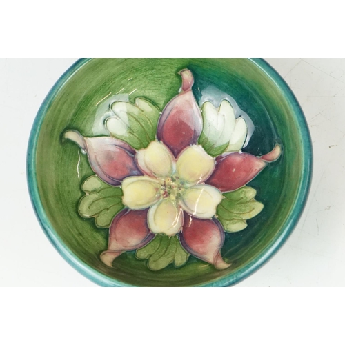 56 - Moorcroft 'Columbine' pattern small footed bowl, blue-green ground, impressed 'Moorcroft' to base, a... 