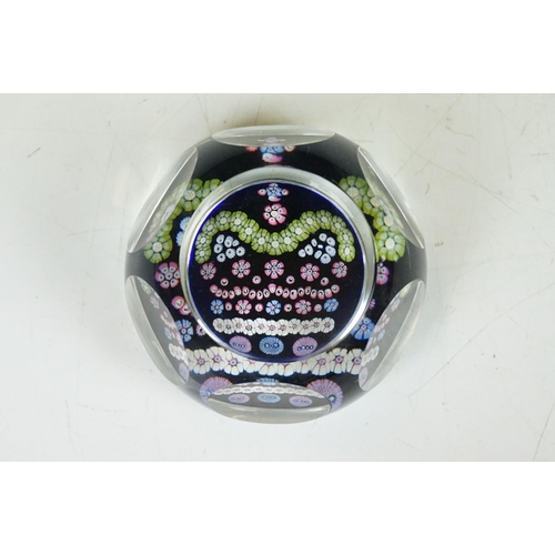 57 - Two Whitefriars QEII silver jubilee faceted glass millefiori paperweights, the millefiori canes depi... 