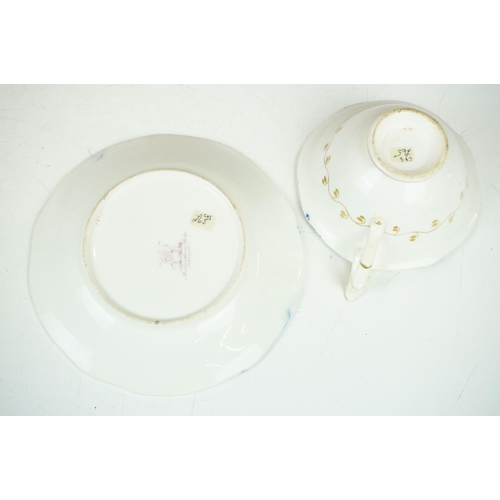 62 - Two 19th century Rockingham porcelain teacups & saucers to include an example decorated with cobalt ... 