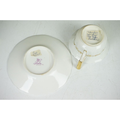 62 - Two 19th century Rockingham porcelain teacups & saucers to include an example decorated with cobalt ... 