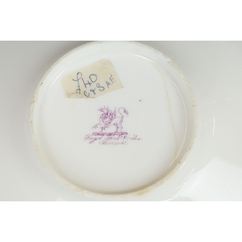 62 - Two 19th century Rockingham porcelain teacups & saucers to include an example decorated with cobalt ... 