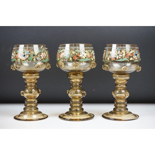 8 - Set of six Bohemian green glass wine glasses, with enamelled floral decoration, applied floral embel... 