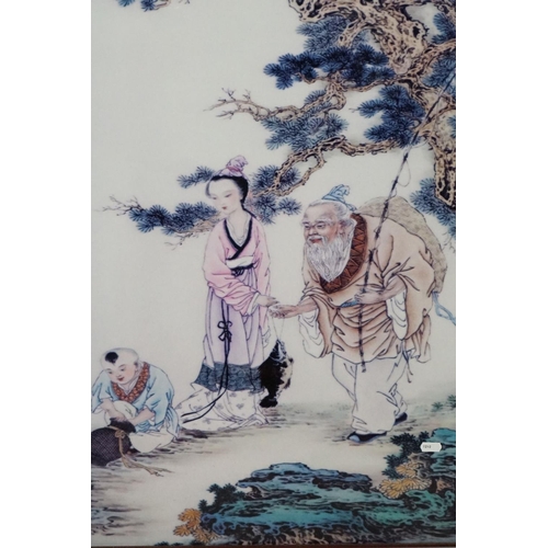 387 - Oriental panel, scene depicting three figures, 78.5 x 56cm, printed on a ceramic plaque, framed and ... 