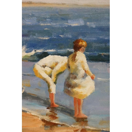 395 - Oil on canvas of an impressionist beach scene with children beachcombing, 29.5cm x 39.5cm