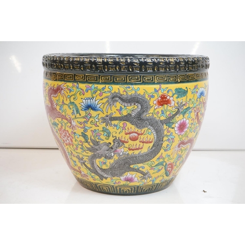 76 - Chinese yellow ground jardiniere, with enamel decoration depicting dragons amongst scrolling foliage... 