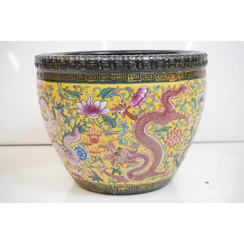 76 - Chinese yellow ground jardiniere, with enamel decoration depicting dragons amongst scrolling foliage... 