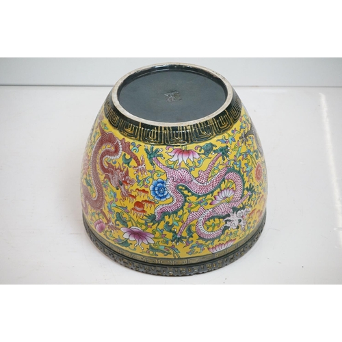 76 - Chinese yellow ground jardiniere, with enamel decoration depicting dragons amongst scrolling foliage... 