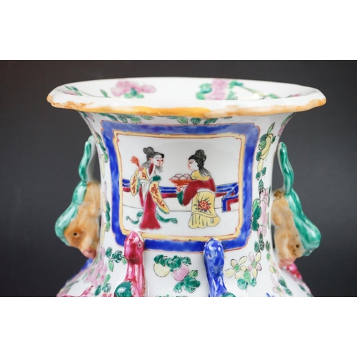 83 - Cantonese Famille Rose vase enamel decorated with figural panels, applied dragons, twin handles mode... 