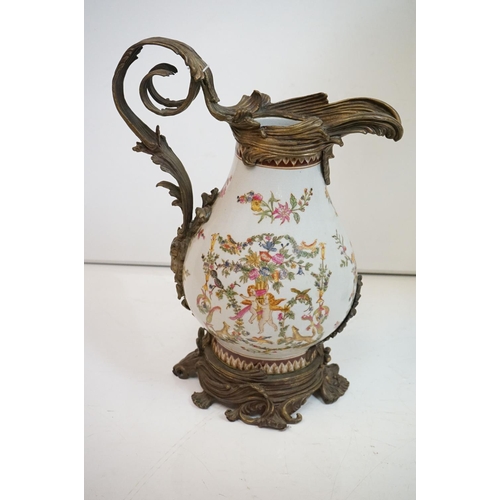 85 - Victorian style Wong Lee brass and ceramic jug of baluster form, with classical decoration of putti,... 