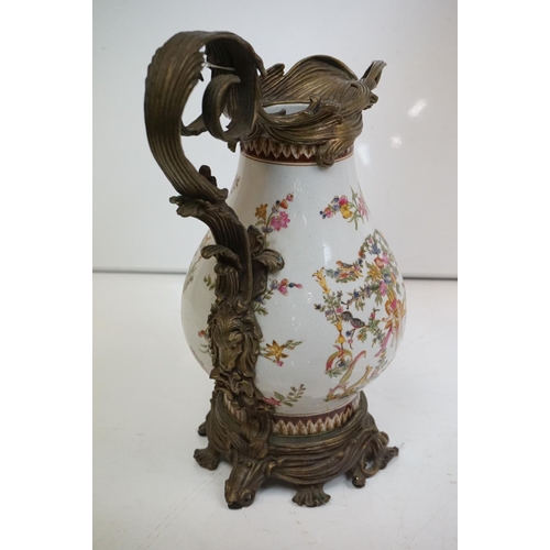 85 - Victorian style Wong Lee brass and ceramic jug of baluster form, with classical decoration of putti,... 