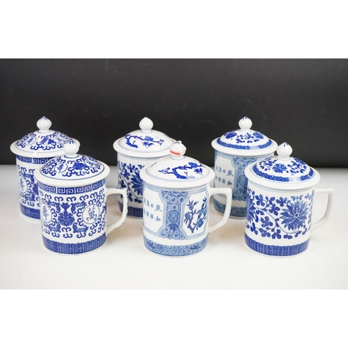 94 - Six Chinese blue and white mugs & covers, three pairs, the designs including floral, foliate and cha... 