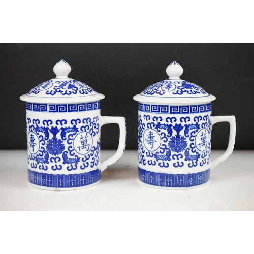 94 - Six Chinese blue and white mugs & covers, three pairs, the designs including floral, foliate and cha... 