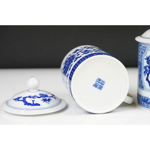 94 - Six Chinese blue and white mugs & covers, three pairs, the designs including floral, foliate and cha... 