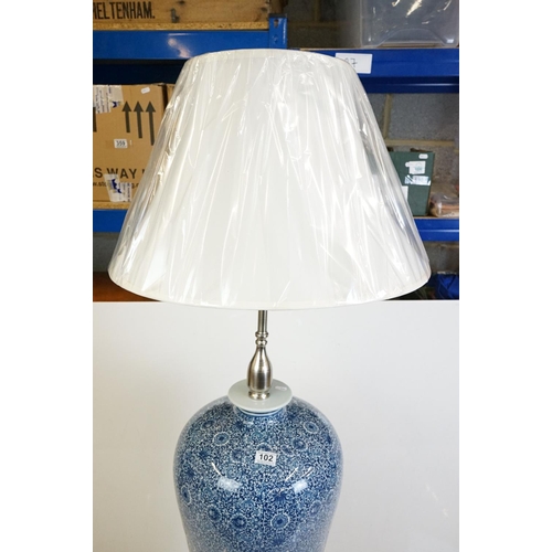 102 - Large Chinese blue & white ceramic standard lamp, of shouldered form, scrolling floral & foliate dec... 