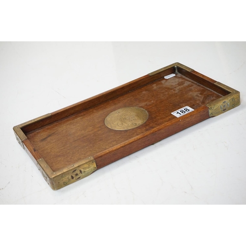 188 - An antique mahogany writing slope with brass fittings together with a wooden Chinese tray with brass... 