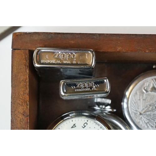 343 - A box of mixed collectables to include zippo lighters, clocks, inkwells....etc..