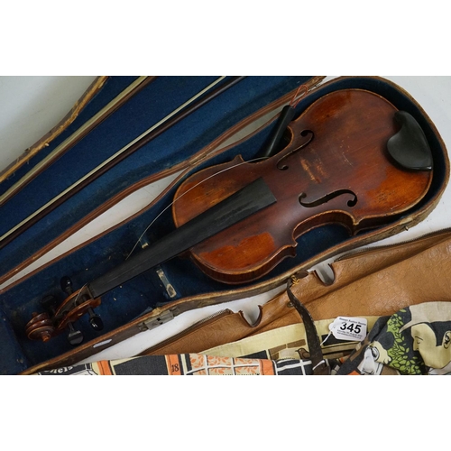 345 - A violin, two piece back, with hard case and bow.