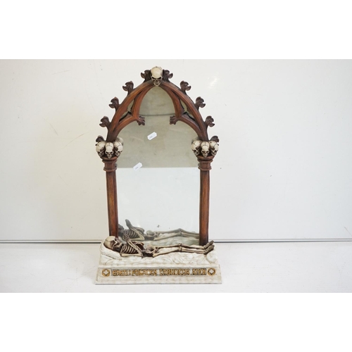 347 - A contemporary gothic style mirror with skeleton decoration.