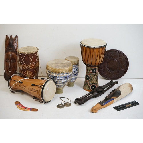 349 - A small collection of wooden African collectables to include a folding table and two masks and four ... 