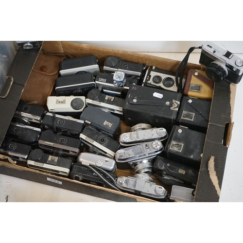 352 - A large collection of mixed cameras to include 35mm, 126, 127 formats.