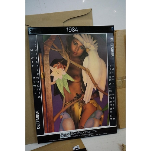 372 - A small selection of wall hanging calendars with erotic images to include a Pirelli example.