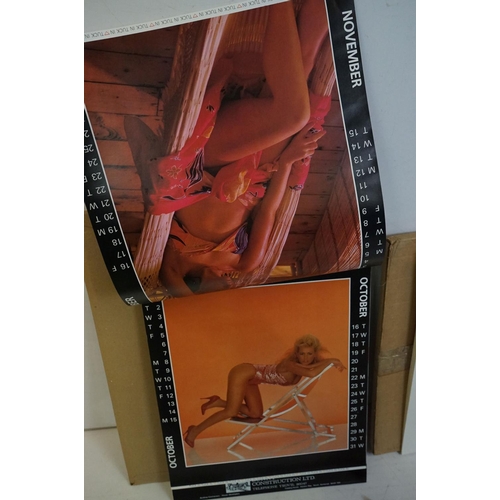 372 - A small selection of wall hanging calendars with erotic images to include a Pirelli example.