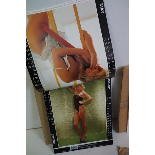 372 - A small selection of wall hanging calendars with erotic images to include a Pirelli example.