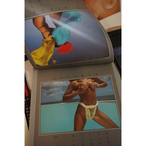 372 - A small selection of wall hanging calendars with erotic images to include a Pirelli example.