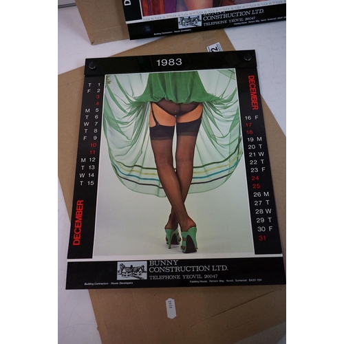 372 - A small selection of wall hanging calendars with erotic images to include a Pirelli example.