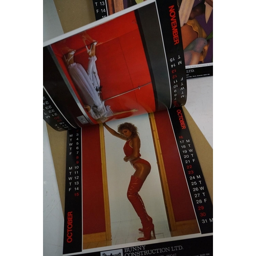 372 - A small selection of wall hanging calendars with erotic images to include a Pirelli example.